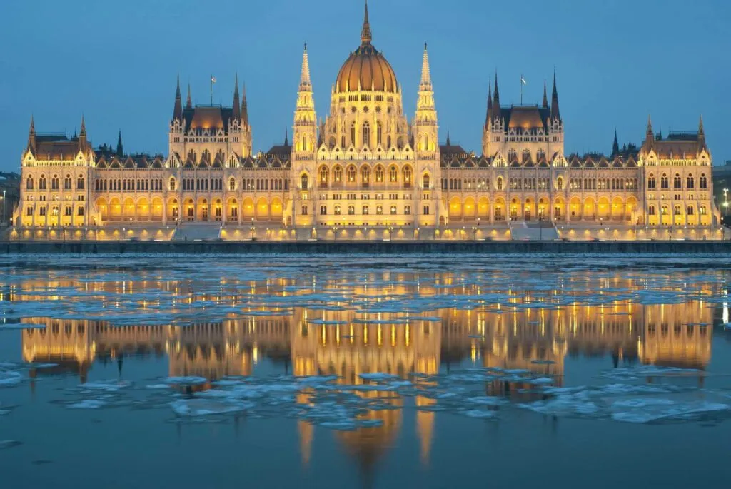 Hungarian parliament building at winter, ice drift on Danube river (Budapest)