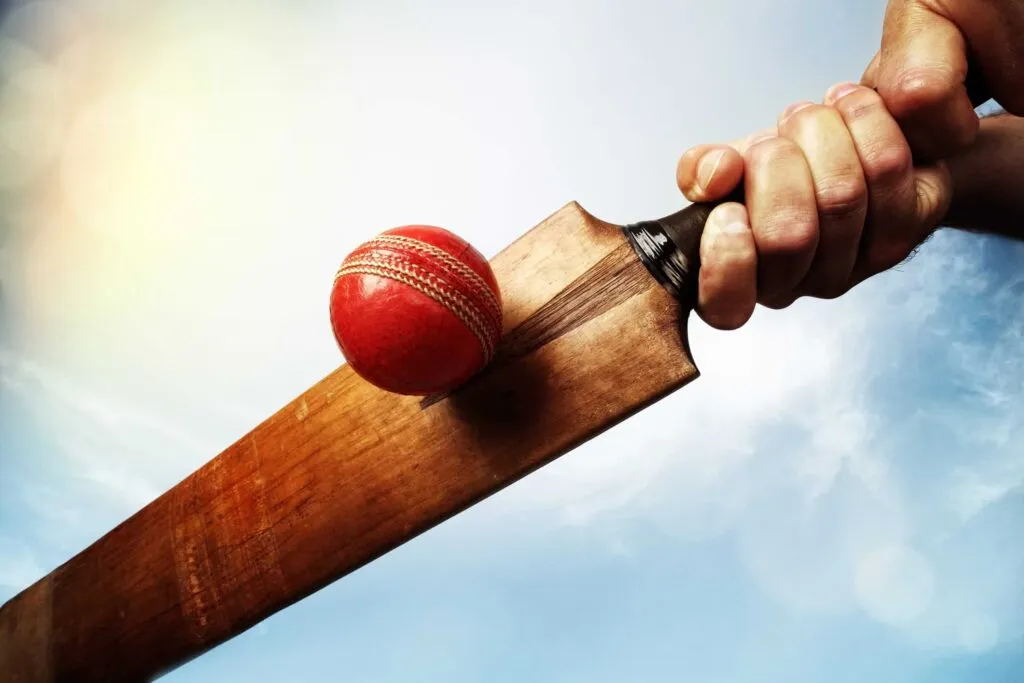 Cricket bat hitting a cricket ball