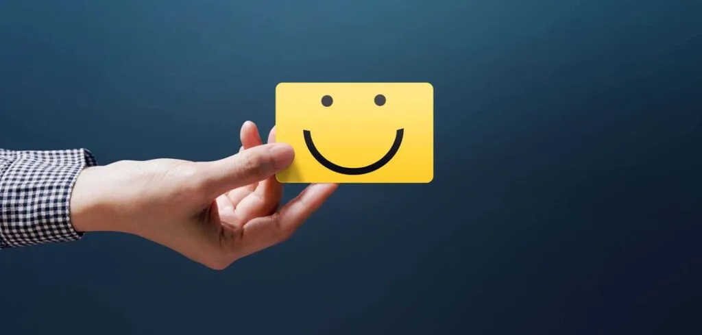Customer Experience Concept, Happy Client Woman show a Feedback with Happy Smiley Face Card