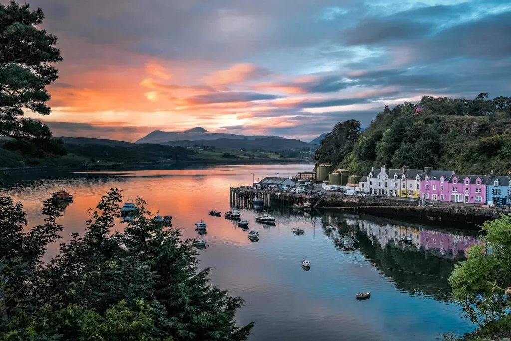 Dawn breaks over the colourful harbour of Portree, Isle of Skye.