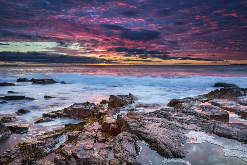 A beautiful sunrise at the rocky beach of Thunder Hole in Acadia National Park, Maine, USA.