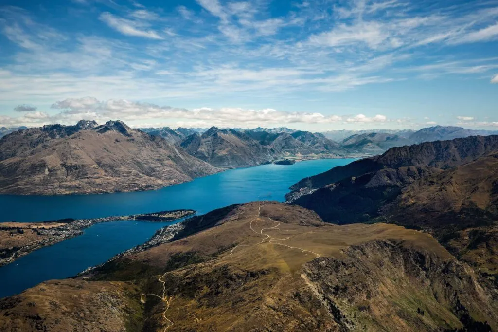 Aerial view of Queenstown, Lake Wakatipu and the surrounding mountains. Photo by Samuel Ferrara on Unsplash